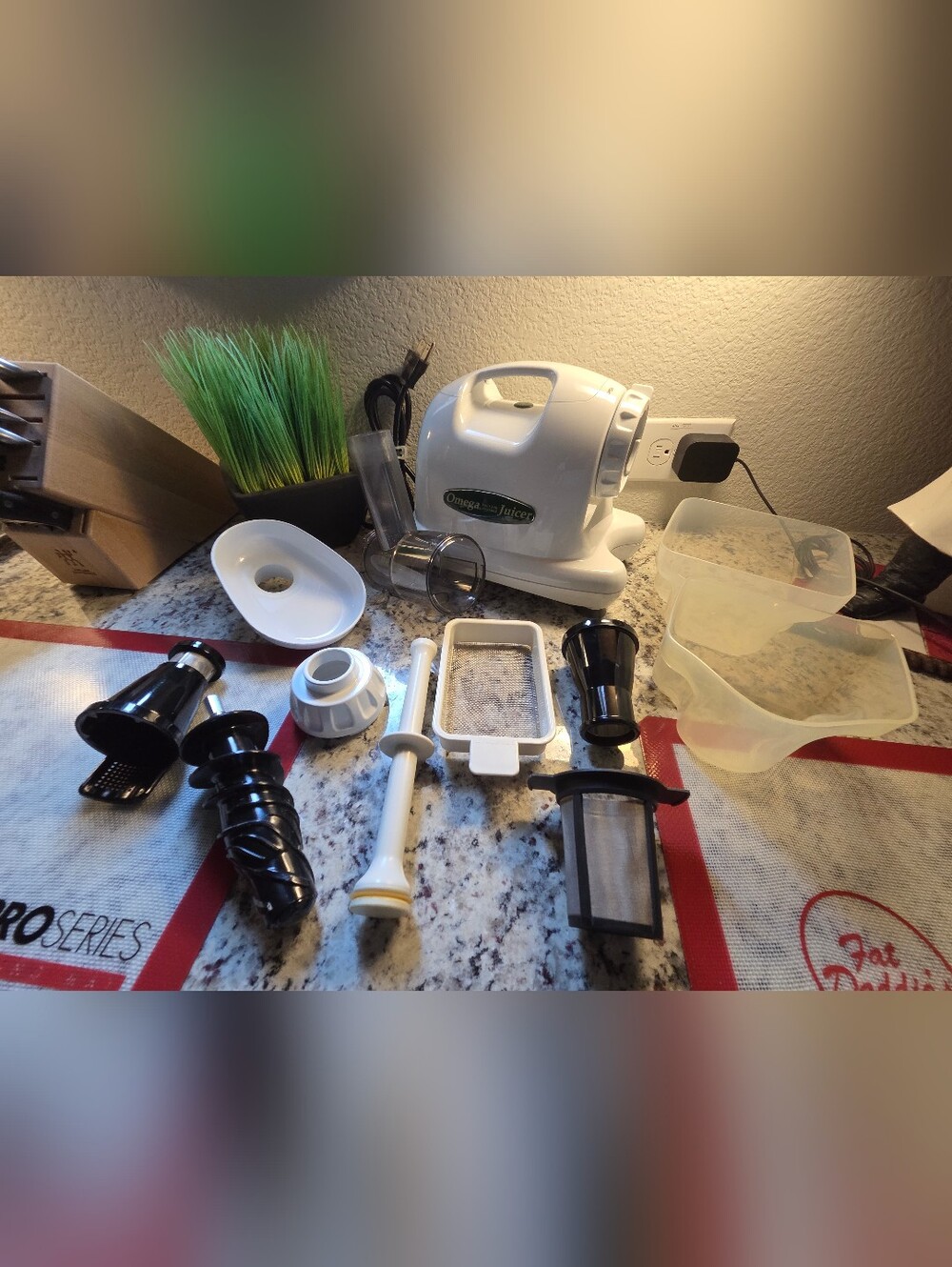 Omega White Juicer with Multiple Black and White Attachments